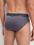 Herren-Model trägt Mini-Slip, Elastikbund aus Baumwolle in Grau, Einfarbig aus Serie Pure & Style von CALIDA, Rückansicht