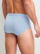 Men model is wearing Classic brief with fly made of 100% Cotton in Blue, Unicoloured from the Twisted Cotton series by CALIDA, Back view