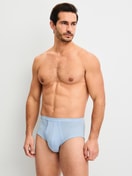 Men model is wearing Classic brief with fly made of 100% Cotton in Blue, Unicoloured from the Twisted Cotton series by CALIDA, Outfit