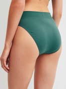 Women model is wearing Brief, high waist made of Cotton in Green, Unicoloured from the Elastic series by CALIDA, Back view