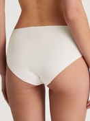Damen-Model trägt Seamless-Midislip, 2er-Pack aus Modal in Beige, Einfarbig aus Serie Natural Skin Duo von CALIDA, Rückansicht