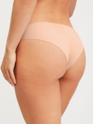 Women model is wearing Seamless Brazilian Brief made of Modal in Pink, Unicoloured from the Natural Skin series by CALIDA, Back view