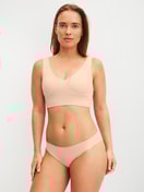 Women model is wearing Seamless Brazilian Brief made of Modal in Pink, Unicoloured from the Natural Skin series by CALIDA, Outfit