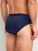 Men model is wearing Brief made of Lyocell in Blue, Unicoloured from the Natural Cooling series by CALIDA, Back view