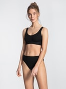 Women model is wearing High Waist Briefs, 2-Pack made of Cotton in Black, Unicoloured from the Elastic Duopack series by CALIDA, Outfit