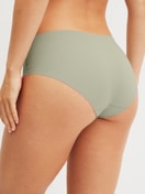 Damen-Model trägt Seamless-Midi-Slip aus Modal in Grün, Einfarbig aus Serie Natural Skin von CALIDA, Rückansicht