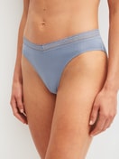 Women model is wearing Brazilian Brief made of Modal in Blue, Lace from the Etude Ajours series by CALIDA, Front view