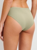 Women model is wearing Briefs, 2-Pack made of Cotton in Green, Unicoloured from the Benefit Women Spec. series by CALIDA, Back view