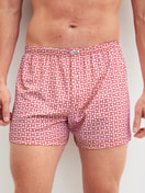 Men model is wearing Boxer shorts made of Cotton in Red, Patterned from the Valentine series by CALIDA, Front view