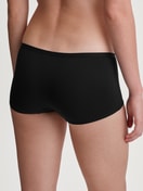 Le mannequin Femme porte le/la Panty taille haute en Polyamide de couleur Noir, Unicolore, de la série Sleek Skin de CALIDA, Vue arrière