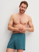 Le mannequin Homme porte le/la Boxershorts, lot de 2 en 100% coton de couleur Turquoise, À motifs, de la série Cotton Special de CALIDA, Tenue