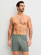 Men model is wearing Boxer shorts made of 100% Cotton in Green, Checked from the Prints series by CALIDA, Outfit