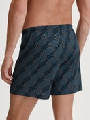 Men model is wearing Boxer shorts made of 100% Cotton in Black, Patterned from the Prints series by CALIDA, Back view