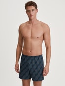 Men model is wearing Boxer shorts made of 100% Cotton in Black, Patterned from the Prints series by CALIDA, Outfit