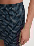 Men model is wearing Boxer shorts made of 100% Cotton in Black, Patterned from the Prints series by CALIDA, Detail
