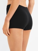 Women model is wearing Shorty regular cut made of Modal in Black, Unicoloured from the Seamless Natural series by CALIDA, Back view