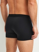 Men model is wearing Boxer brief made of Polyamide in Black, Unicoloured from the Micro Stretch series by CALIDA, Back view