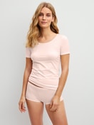 Women model is wearing Shorty regular cut made of Cotton in Pink, Unicoloured from the Natural Comfort series by CALIDA, Outfit