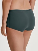Women model is wearing Shorty regular cut made of Cotton in Green, Unicoloured from the Natural Comfort series by CALIDA, Back view