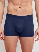 Men model is wearing Boxer brief made of Lyocell in Blue, Unicoloured from the Natural Cooling series by CALIDA, Front view