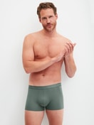 Men model is wearing Boxer brief made of Cotton in Green, Unicoloured from the Evolution series by CALIDA, Outfit