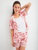 Women model is wearing Pyjama shorts made of 100% Cotton in Orange, Floral from the Favourites Beach series by CALIDA, Outfit