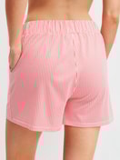 La modella / Il modello Donna indossa Pantaloni corti del pigiama in Cotone di colore Arancione, A righe, della serie Favourites Beach di CALIDA, Vista posteriore