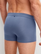 Men model is wearing Boxer brief with Quick Dry Effect made of Modal in Blue, Unicoloured from the Balanced Day series by CALIDA, Back view