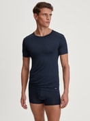 Men model is wearing Boxerbrief made of TENCEL™ in Blue, Unicoloured from the Balanced Day series by CALIDA, Outfit