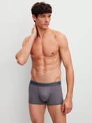 Men model is wearing Boxer brief, elastic waistband made of Cotton in Grey, Unicoloured from the Pure & Style series by CALIDA, Outfit