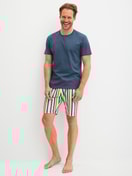 Men model is wearing Bermudas made of Cotton in Yellow, Patterned from the RMX Sleep Holiday series by CALIDA, Outfit