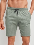 Men model is wearing Bermudas made of 100% Cotton in Green, Unicoloured from the RMX Sleep Leisure series by CALIDA, Front view
