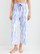 Women model is wearing 7/8 pyjama trousers made of Cotton in Blue, Patterned from the Favourites Ocean series by CALIDA, Front view