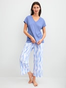 Women model is wearing 7/8 pyjama trousers made of Cotton in Blue, Patterned from the Favourites Ocean series by CALIDA, Outfit