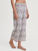 Women model is wearing 7/8 Pyjama bottom made of 100% Cotton in Pink, Patterned from the Favourites Botanic series by CALIDA, Front view