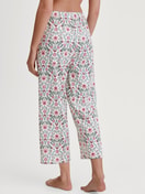 Women model is wearing 7/8 Pyjama bottom made of 100% Cotton in Pink, Patterned from the Favourites Botanic series by CALIDA, Back view