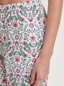 Women model is wearing 7/8 Pyjama bottom made of 100% Cotton in Pink, Patterned from the Favourites Botanic series by CALIDA, Detail