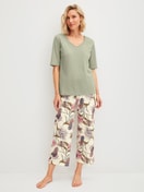 Women model is wearing 7/8 pyjama trousers made of 100% Cotton in Beige, Floral from the Favourites Arts series by CALIDA, Outfit