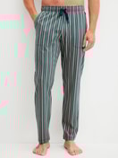 Men model is wearing Pyjama Bottoms with Side Pockets made of 100% Cotton in Green, Striped from the RMX Sleep Leisure series by CALIDA, Front view