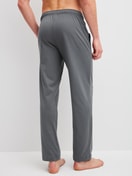 Men model is wearing Pyjama Bottoms with Side Pockets made of 100% Cotton in Grey, Unicoloured from the RMX Sleep Leisure series by CALIDA, Back view