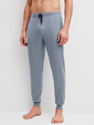 Men model is wearing Pyjama bottom with cuffs made of Lyocell in Grey, Unicoloured from the DSW Warming series by CALIDA, Front view