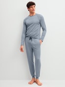 Men model is wearing Pyjama bottom with cuffs made of Lyocell in Grey, Unicoloured from the DSW Warming series by CALIDA, Outfit