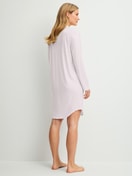Women model is wearing Long Sleeve Nightdress – 100 cm Length made of Modal in Pink, Unicoloured from the Striped Dreams series by CALIDA, Back view