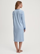 Women model is wearing Long Sleeve Nightdress – 110 cm Length made of 100% Cotton in Blue, Striped from the Midnight Stripes series by CALIDA, Back view
