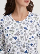 Women model is wearing Long-sleeve nightdress, length 100 cm made of 100% Cotton in Blue, Floral from the Flower Nights series by CALIDA, Detail