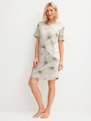 Women model is wearing Short-sleeved nightdress, length 95 cm made of 100% Cotton in Green, Floral from the Leaf Dreams series by CALIDA, Front view