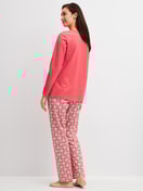 Women model is wearing Pyjamas, long made of 100% Cotton in Red, Patterned from the Cotton Special series by CALIDA, Back view