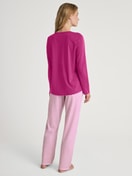 Women model is wearing Pyjamas, long made of 100% Cotton in Red, Patterned from the Cotton Special series by CALIDA, Back view