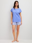 Women model is wearing Short pyjama made of 100% Cotton in Blue, Floral from the Cotton Special series by CALIDA, Front view