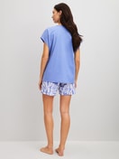 Women model is wearing Short pyjama made of 100% Cotton in Blue, Floral from the Cotton Special series by CALIDA, Back view